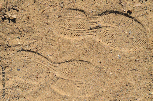 Schuhabdrücke in Sand