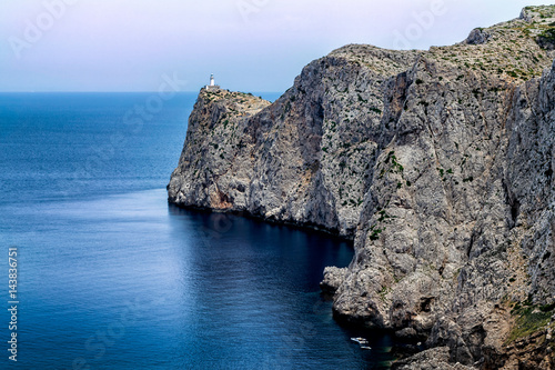 Distant view of the amazing lighthouse of Cap de Formentor in Mallorca island
