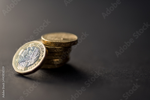 New british one sterling pound coin on dark background