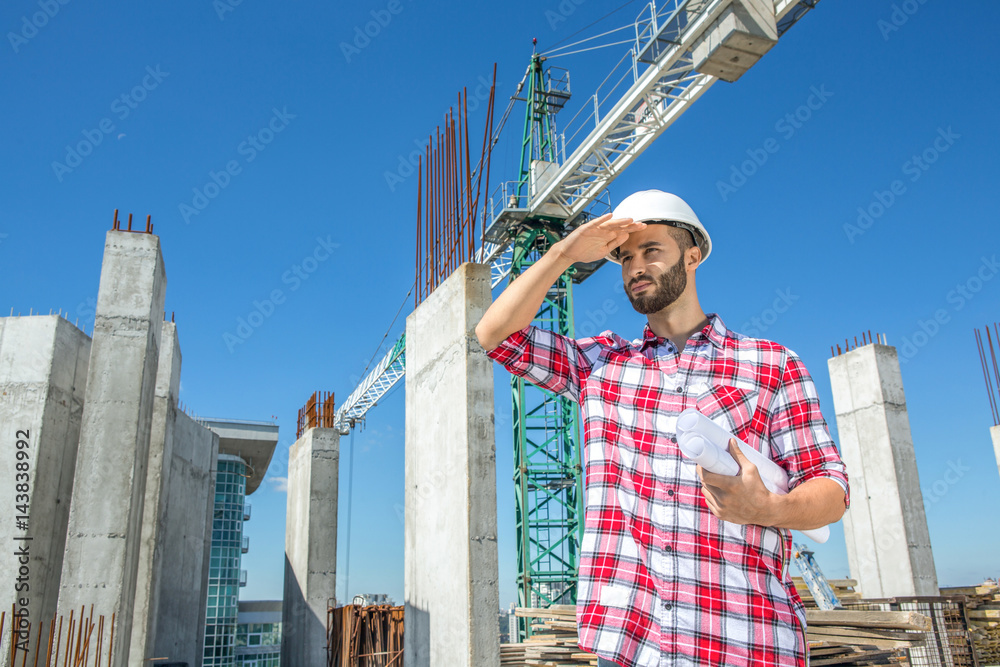 Handsome engineer at the construction site Handsome engineer at the construction site