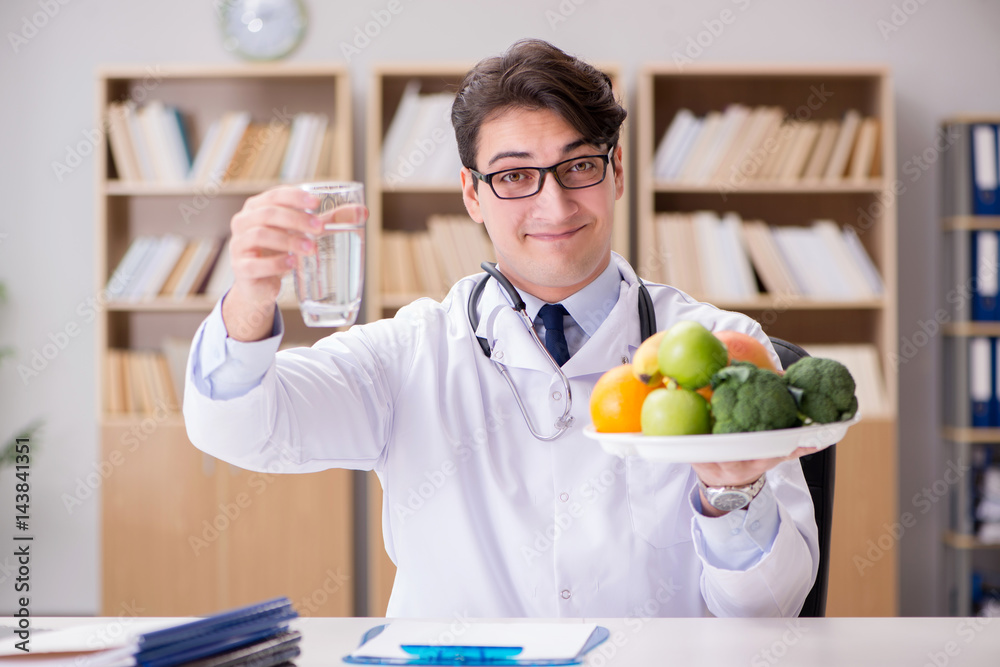 Doctor in dieting concept with fruits and vegetables Doctor in dieting concept with fruits and vegetables