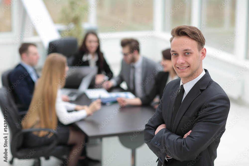 Face of handsome businessman on the background of business peopl Face of handsome businessman on the background of business peopl