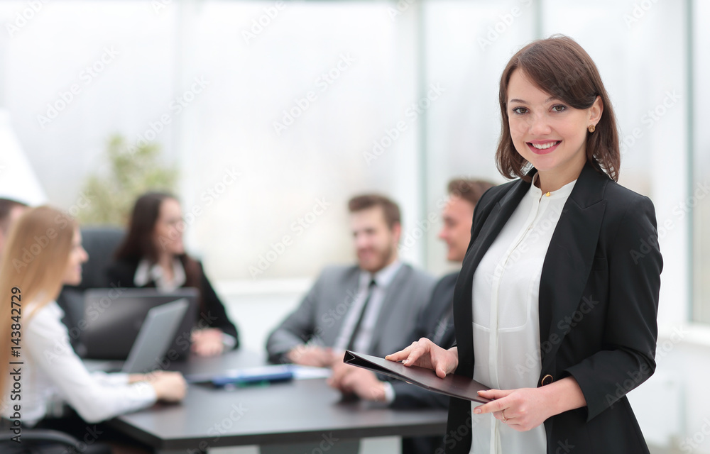 Portrait of a smiling young businesswoman looking at camera with