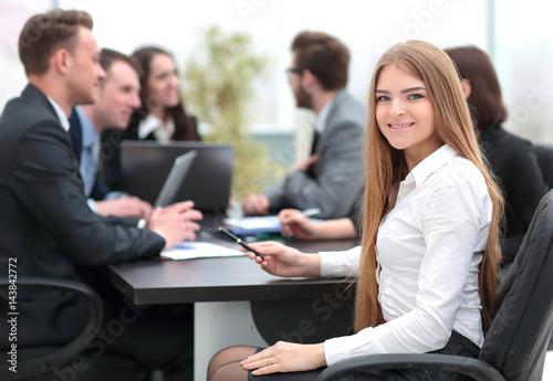 Portrait of a smiling young businesswoman looking at camera with