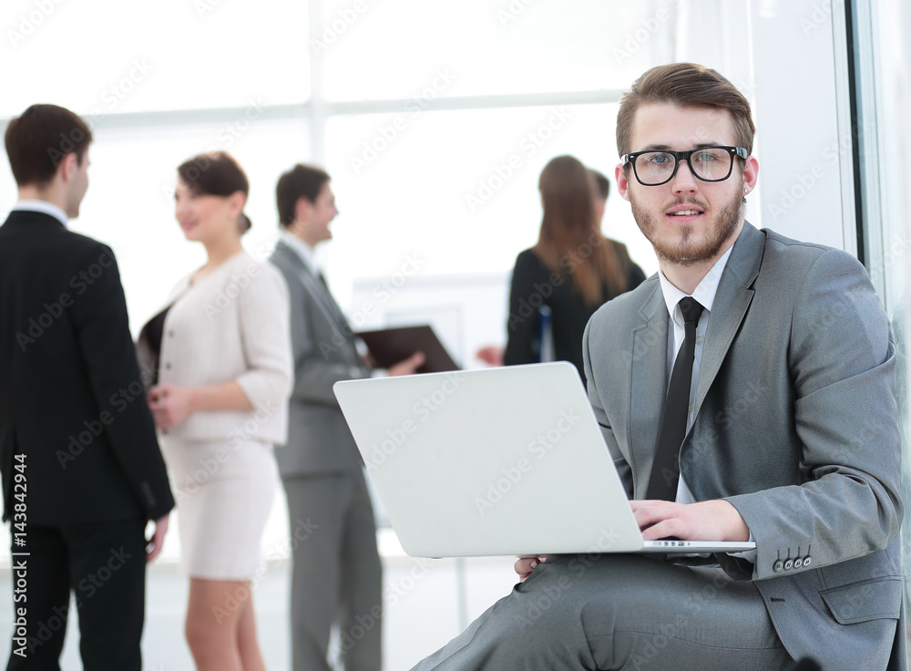 Face of handsome businessman on the background of business peopl Face of handsome businessman on the background of business peopl