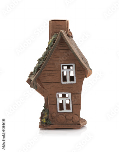 Old clay house on a white background with a shadow. Isolated