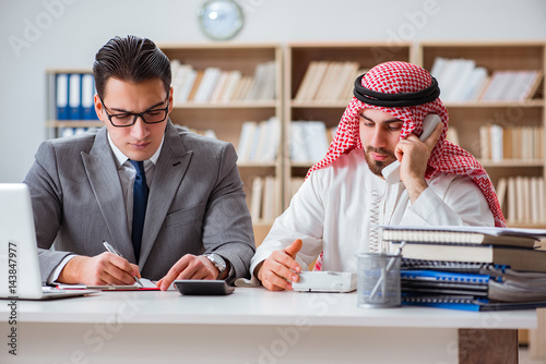 Diverse business concept with arab businessman photo