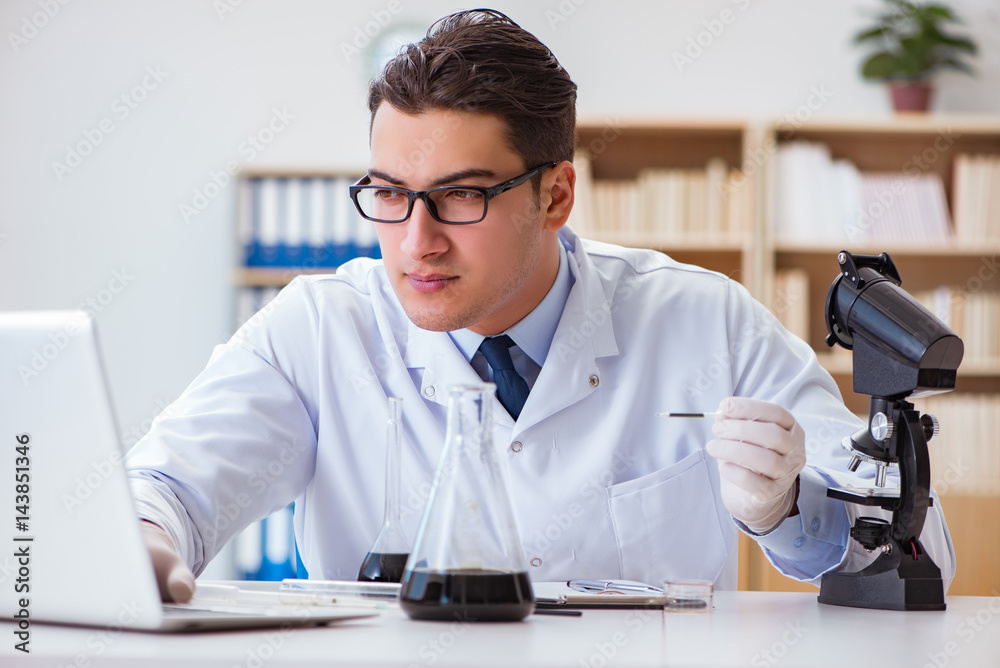 Chemical engineer working on oil samples in lab Chemical engineer working on oil samples in lab
