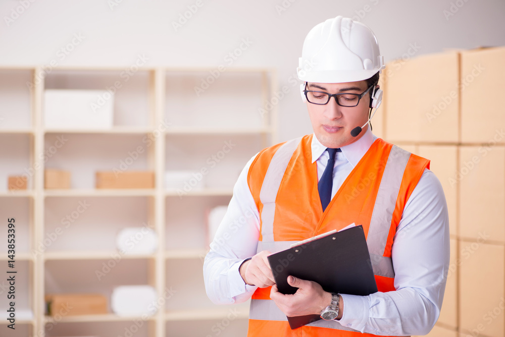 Man working in postal parcel delivery service office Man working in postal parcel delivery service office