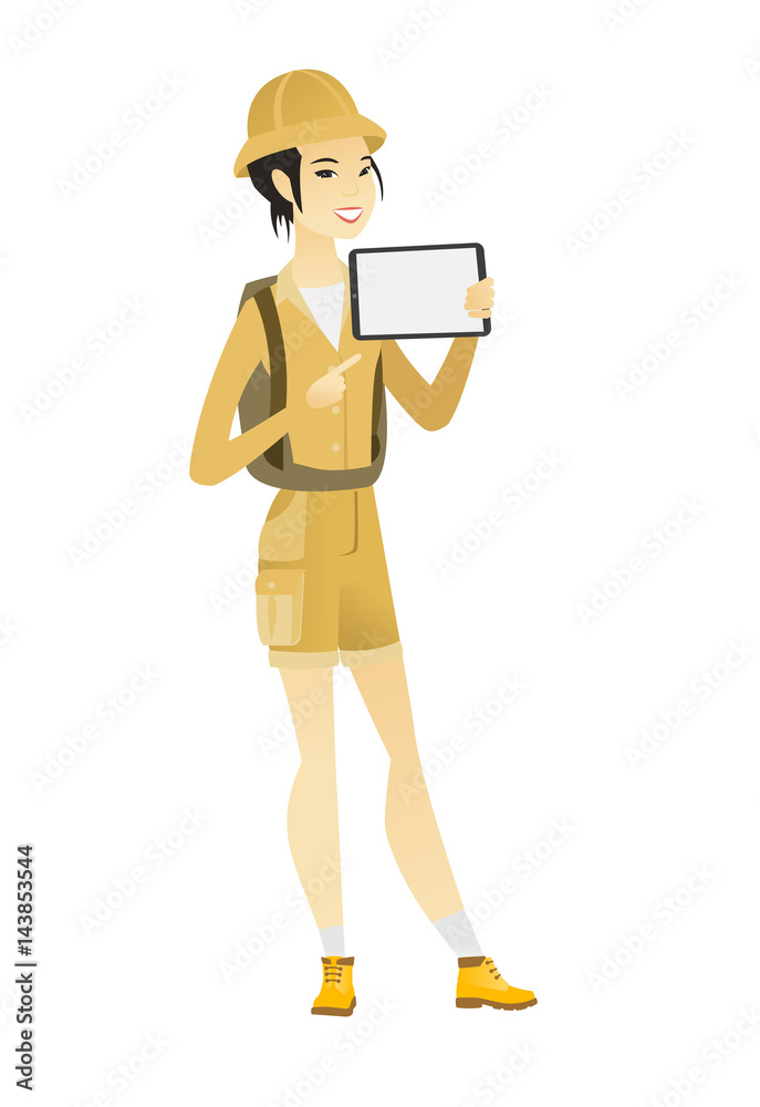 Smiling traveler holding tablet computer.