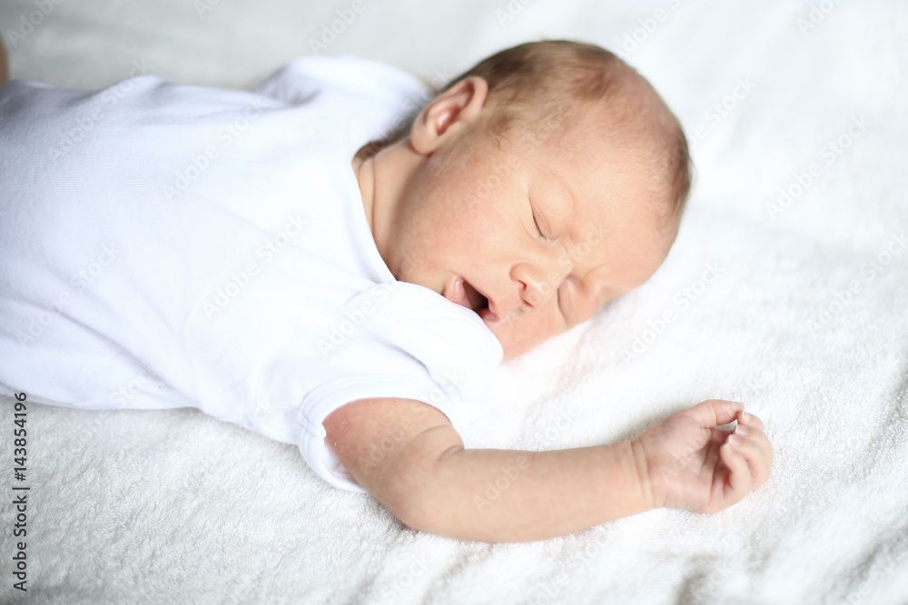 cute newborn baby sleeping peacefully on white blanket cute newborn baby sleeping peacefully on white blanket