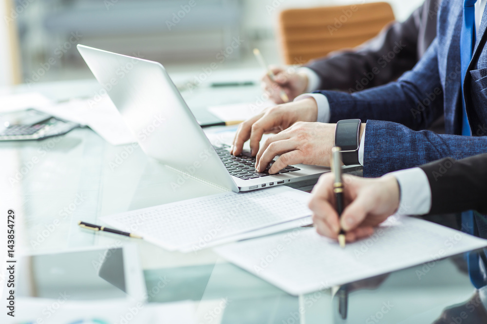 business team conducting analysis of marketing reports at the workplace business team conducting analysis of marketing reports at the workplace