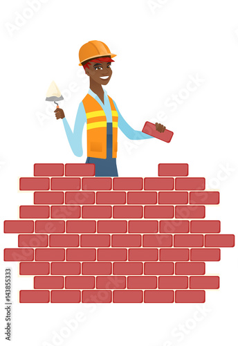 Bricklayer working with spatula and brick.