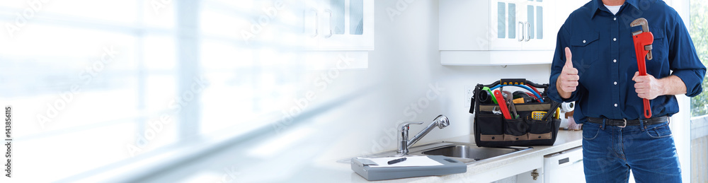 Plumber with wrench.