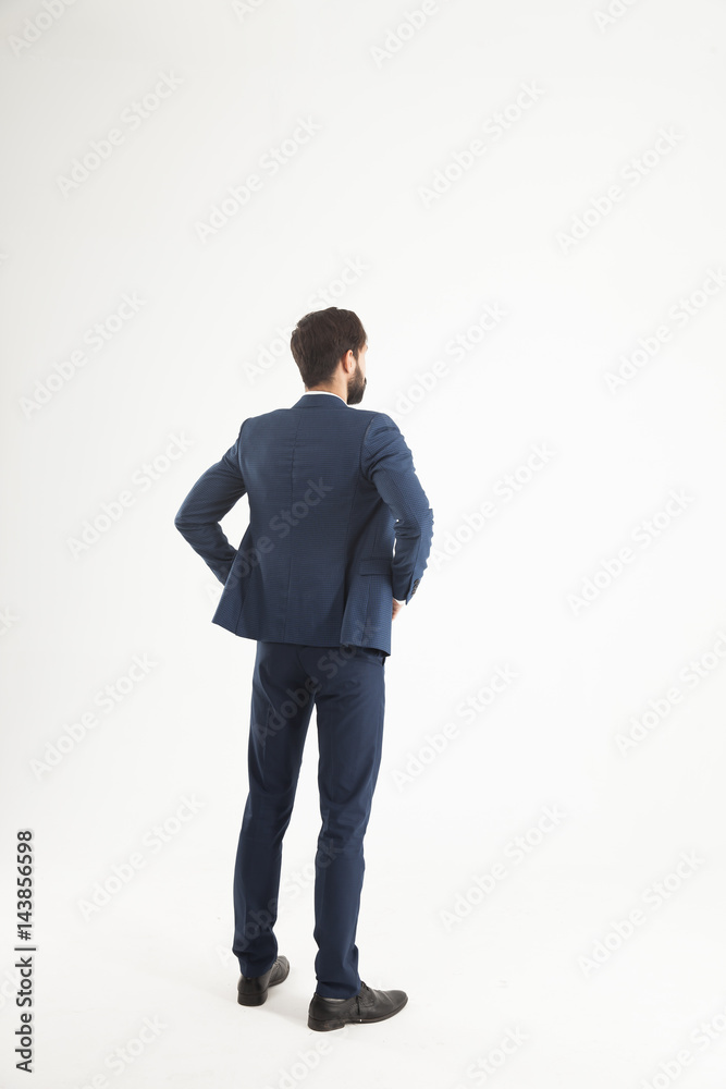 concept of business success - businessman standing back to camer concept of business success - businessman standing back to camer