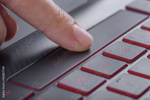 Fototapeta Naklejka Na Ścianę i Meble -  finger pushing space bar button on laptop keyboard