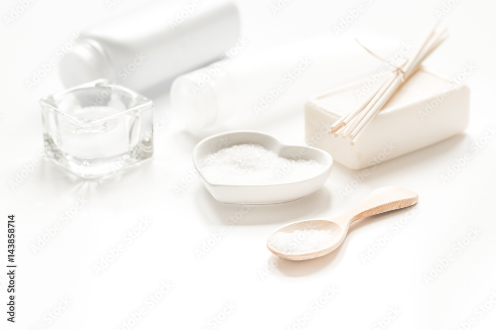 white set of cosmetics for spa on table background white set of cosmetics for spa on table background