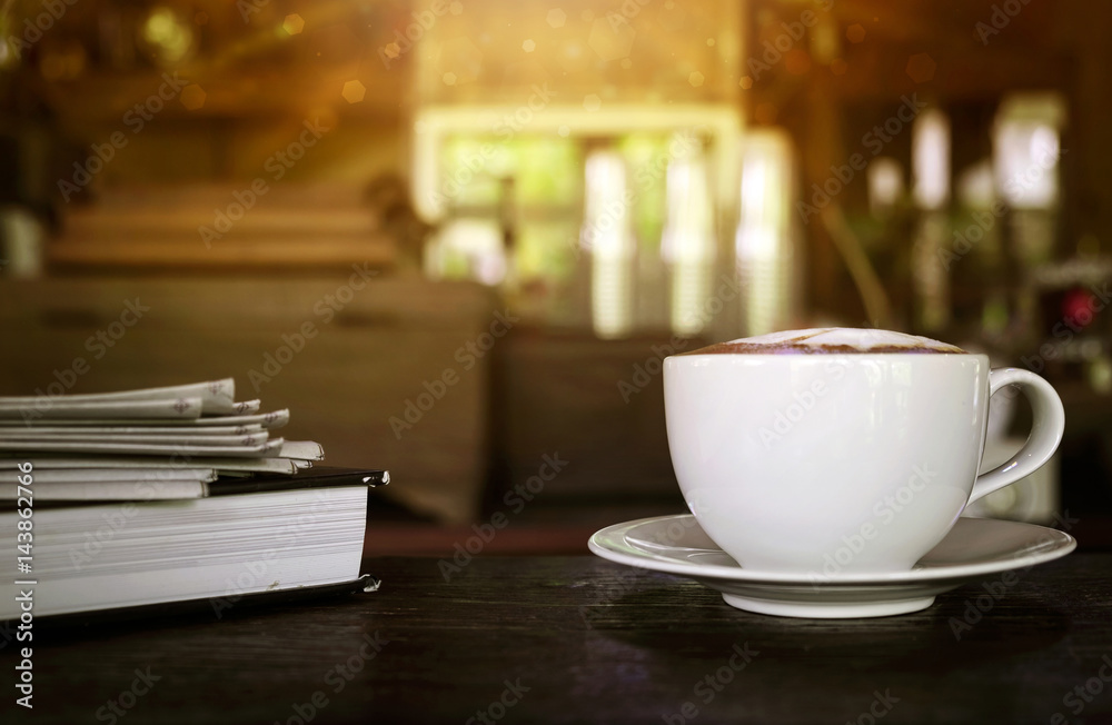 Coffee cup with news paper at coffee shop, summer vintage with sunlight background. Coffee cup with news paper at coffee shop, summer vintage with sunlight background.