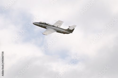 Jet aircraft in cloudy sky