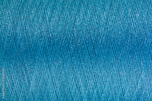 Obraz na plátne Closed up of blue color thread texture background