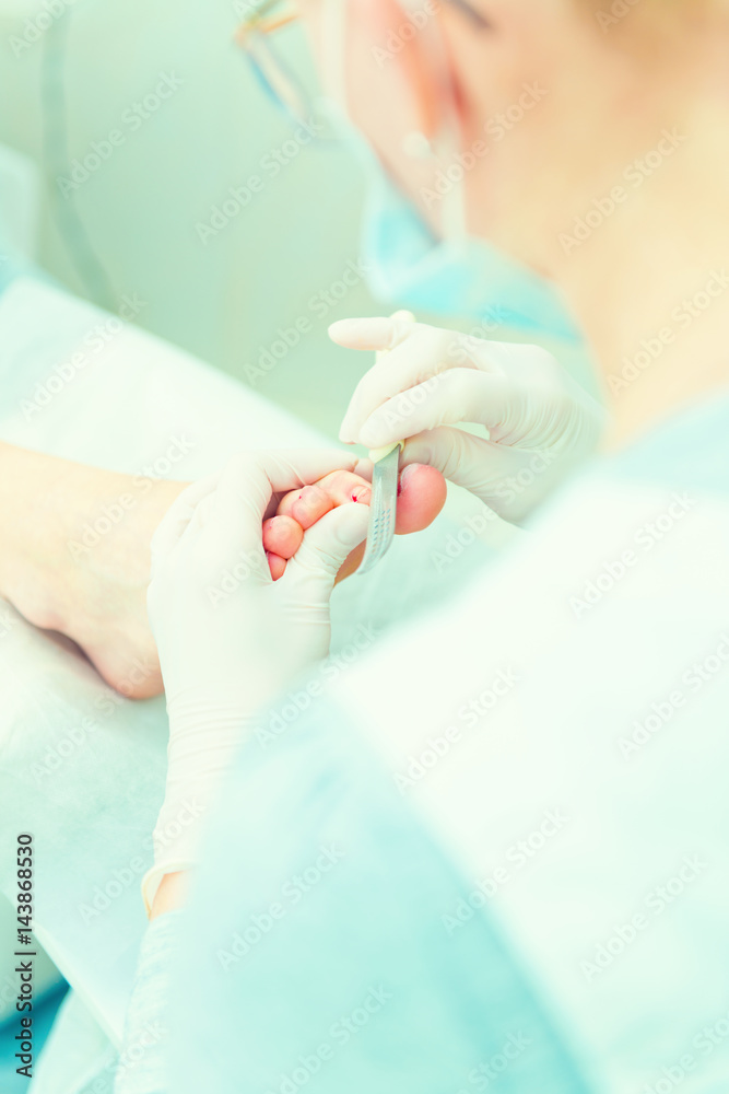 Naklejka premium Pedicure in process