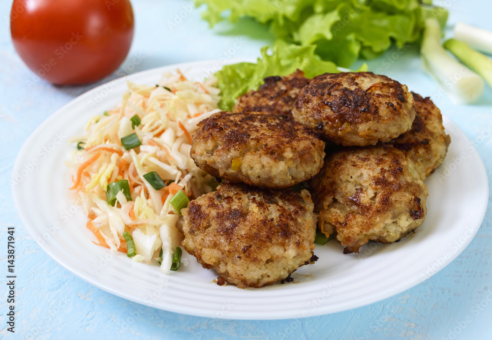 Hamburgers with juicy cutlet, tomatoes, pickled cabbage and cucumbers, cheese, green lettuce leaves and a soft bun with sesame