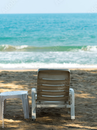 white chair on sand beach