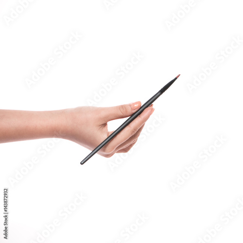 isolated female hand with a brushe for makeup