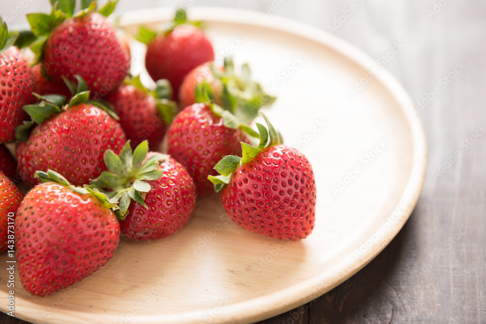 Fresh red strawberries on old wooden background Fresh red strawberries on old wooden background