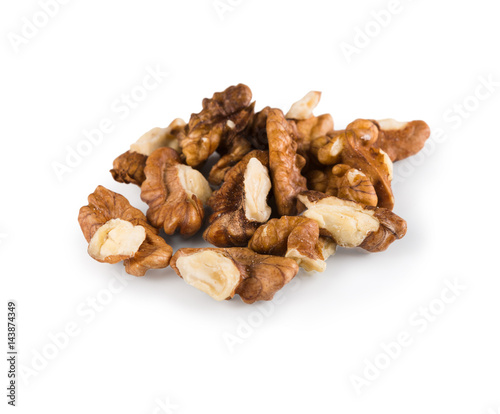 Pile of peeled walnuts close-up isolated on white background