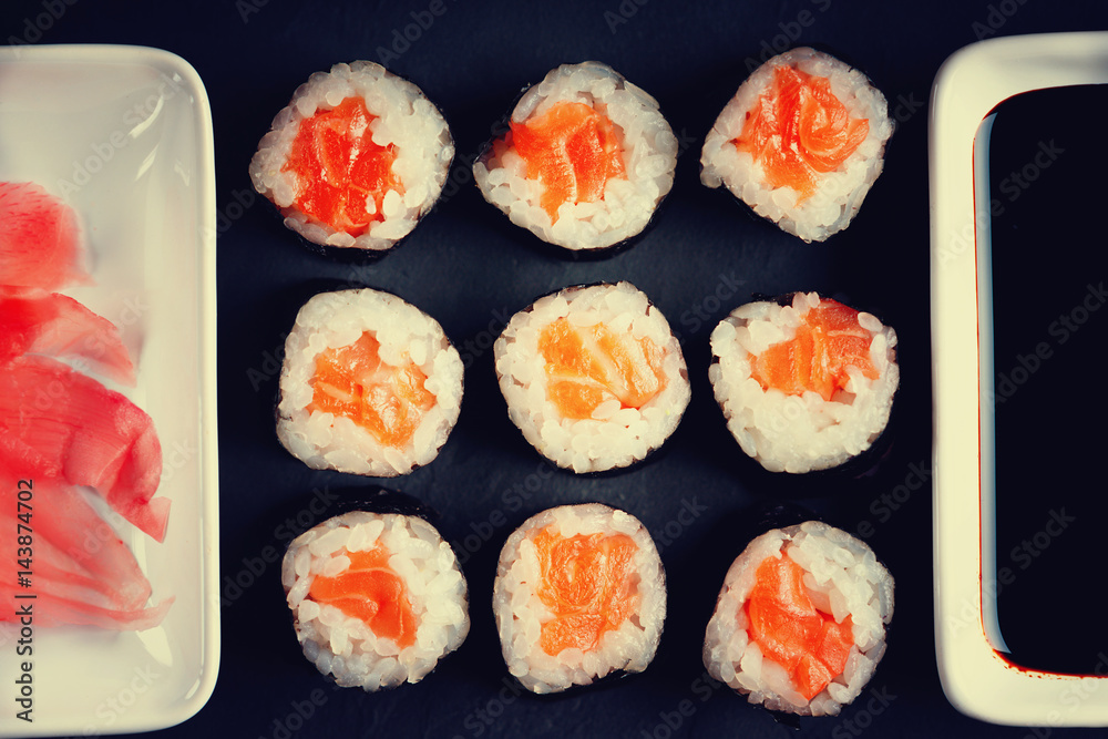 Sushi rolls with salmon, soy sauce and ginger Sushi rolls with salmon, soy sauce and ginger