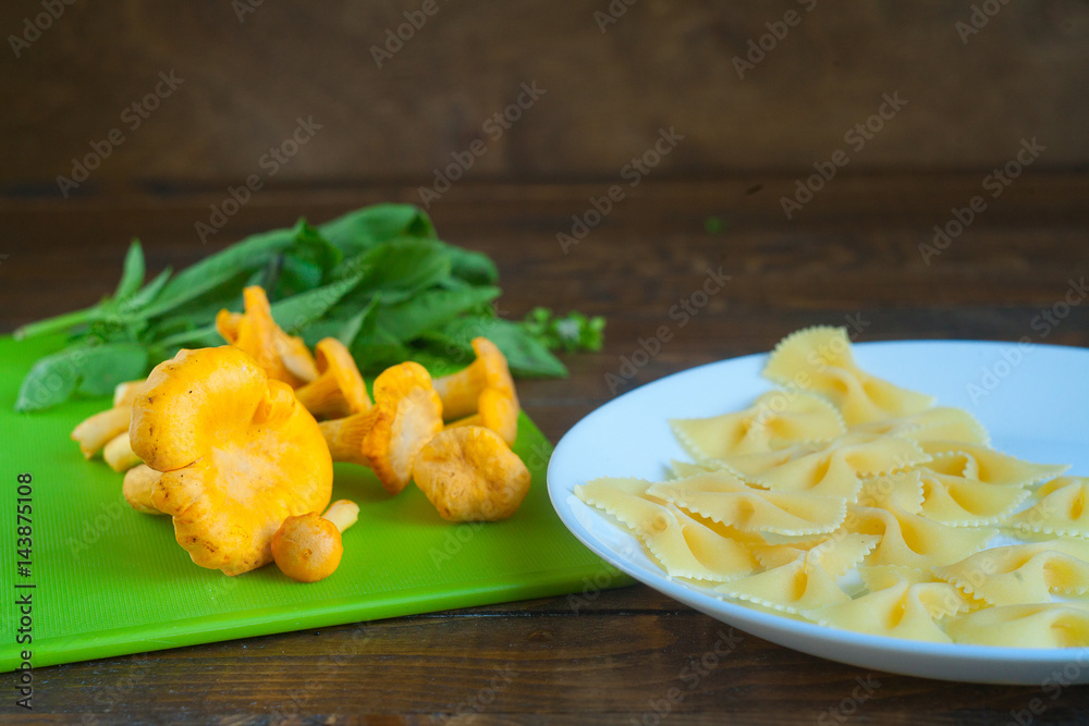 Delicious wild mushrooms chanterelle on the table Delicious wild mushrooms chanterelle on the table