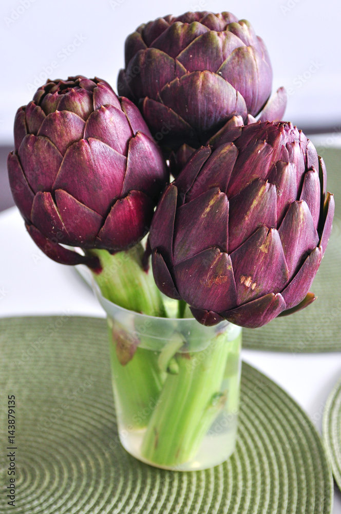 Fototapeta premium Purple artichokes on a table