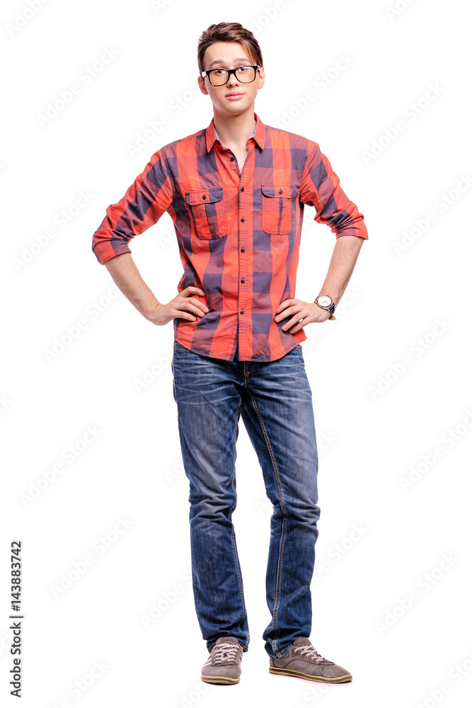 Full length studio portrait of handsome young man in plaid red shirt and jeans. Isolated on white. Full length studio portrait of handsome young man in plaid red shirt and jeans. Isolated on white.