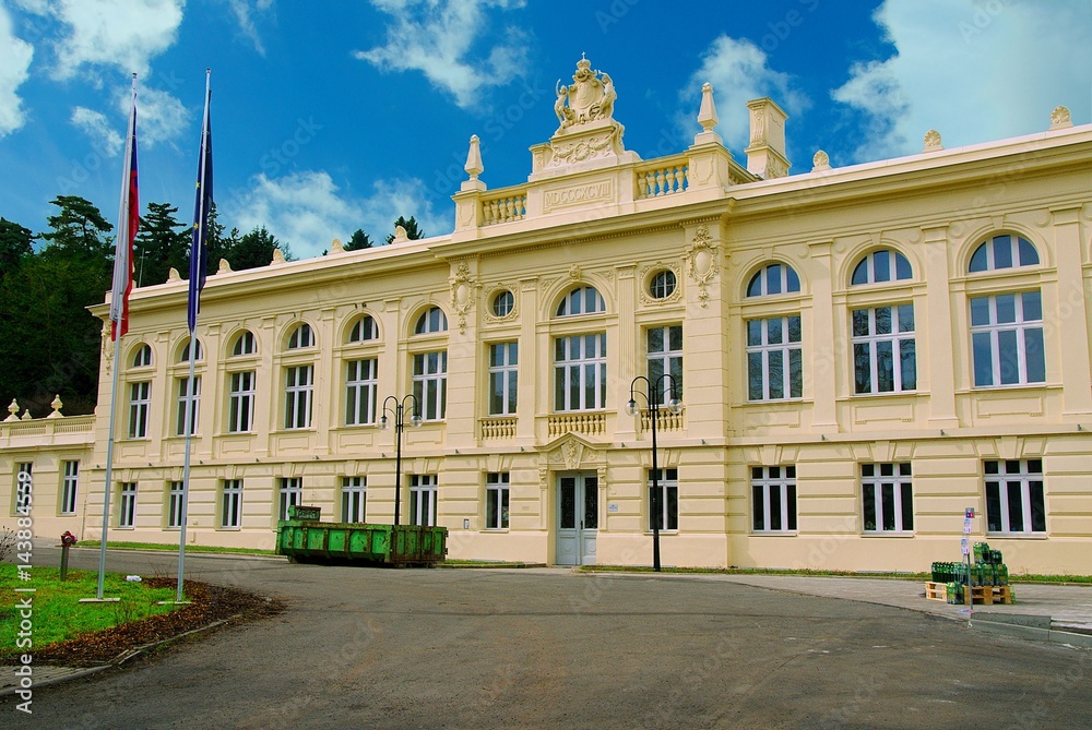 Main historical building and residence of Biliner mineral water  with czech legend 