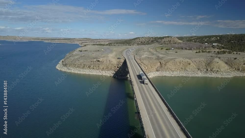 Aerial lake bridge Starvation Reservoir vehicle traffic Utah pt 3. Along Strawberry River is open year round for recreation, fishing and boating. Freedom Bridge spans the lake and is traffic. Aerial lake bridge Starvation Reservoir vehicle traffic Utah pt 3. Along Strawberry River is open year round for recreation, fishing and boating. Freedom Bridge spans the lake and is traffic.