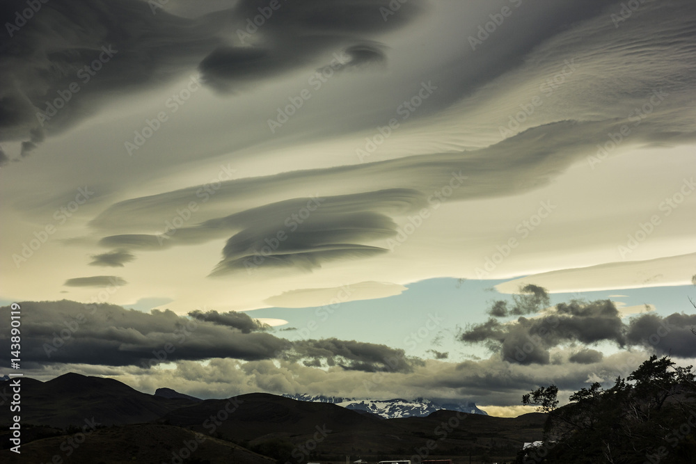 lenticular clouds above snowy mountains in Patagonia