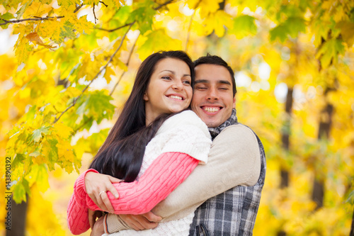 photo of cute couple hugging on the wonderful yellow trees background © Masson