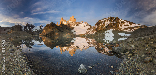 panorama of Fitz Roy mountain and lake at red sunrise