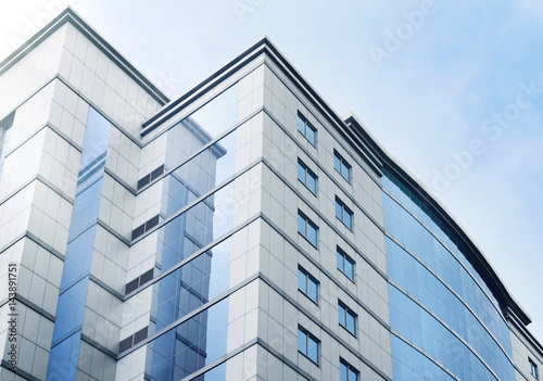 Windows of business office building with blue sky
