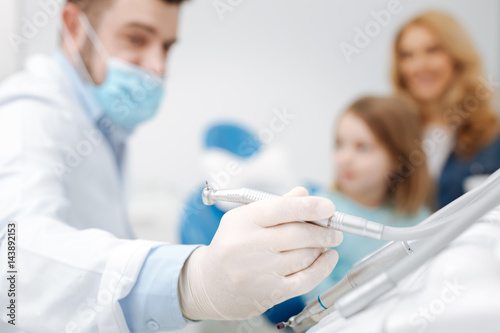 Prominent pediatric dentist taking his tools