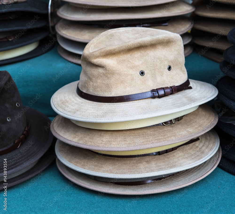 Rack of male hats on sale.