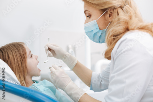 Lovely nice dentist doing a regular check