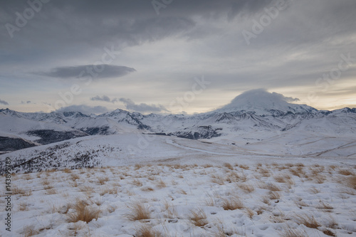 Russia. The formation and movement of clouds above the volcano Elbrus in the Caucasus Mountains in winter.