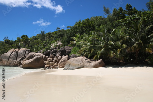 Beach Anse Lazio, Praslin Island, Seychelles, Indian Ocean, Africa / The beautiful white sandy beach is bordered by large red granite rocks. 