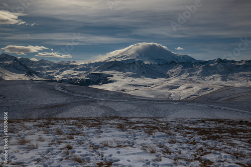 Russia. The formation and movement of clouds above the volcano Elbrus in the Caucasus Mountains in winter.