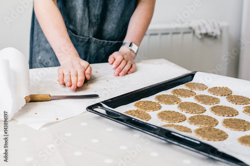 Girl rolling out cookies