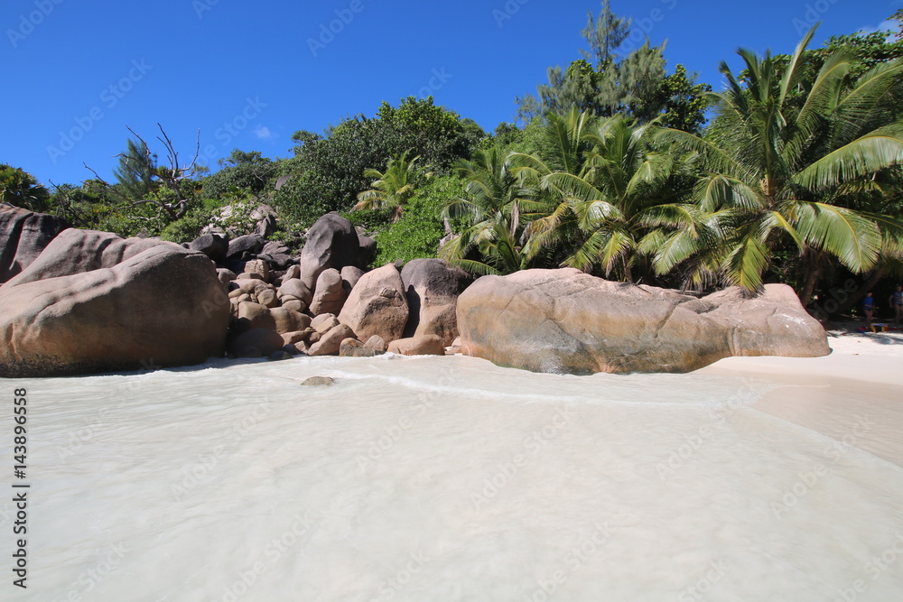 Beach Anse Lazio, Praslin Island, Seychelles, Indian Ocean, Africa / The beautiful white sandy beach is bordered by large red granite rocks. 