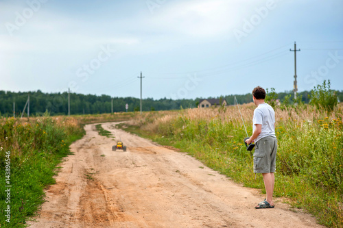 Man is playing with radio-controlled car
