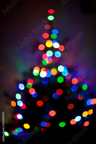 Blurred background made with christmas tree and lights. New year